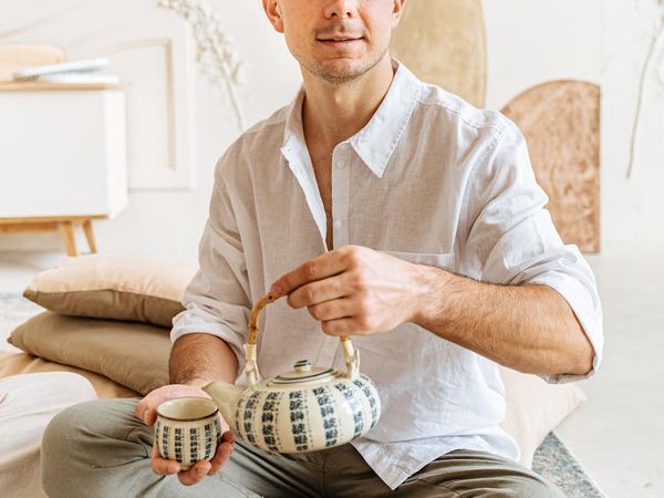 A cozy corner with a yoga mat and a cup of tea, symbolizing a daily ritual.